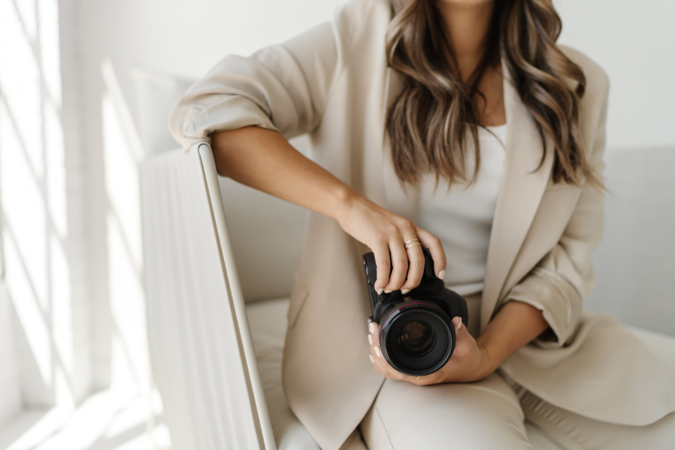 Stock photo of woman photographer holding a camera