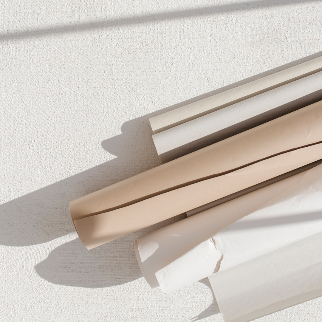 Stock image of neutral colored photo paper rolls.