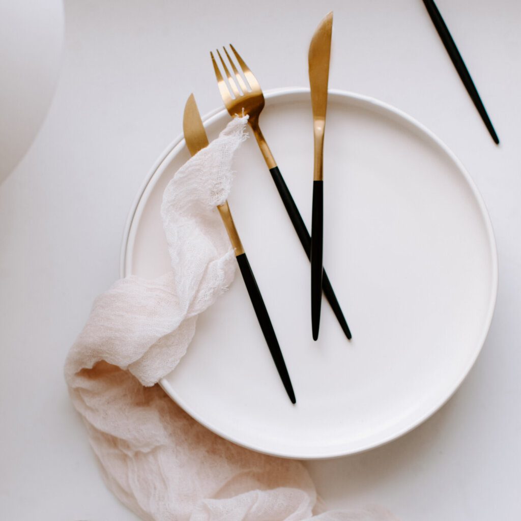 Kitchen stock photography featuring plate and knives and forks.