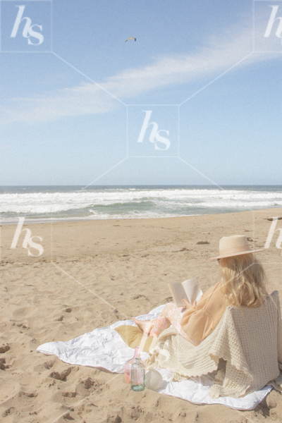 Styled lifestyle photo by Haute Stock of Woman reading and relaxing at the beach