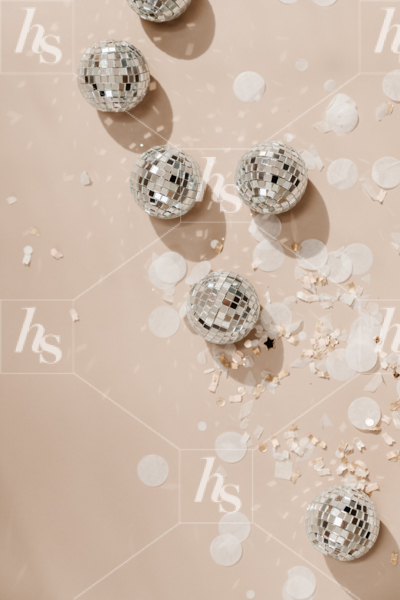 Stock image of mini disco balls on neutral color background