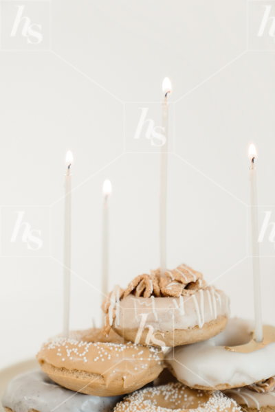 Neutral color donut cake with lit candles, perfect stock images by Haute Stock for event planners and bloggers