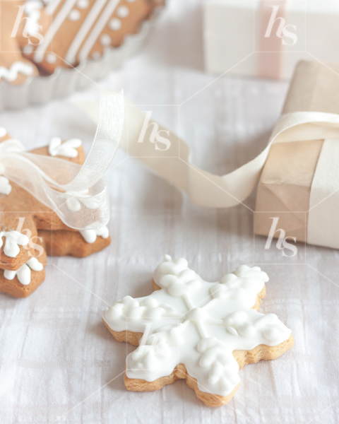Decorated cookies next to wrapped presents, Haute Stock holiday image