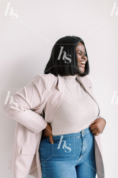 Stock image by Haute Stock featuring a confident plus size African American woman laughing