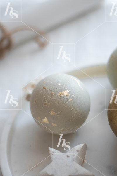 Close-up image of a white and golden Christmas ornament, stock photos for holiday marketing