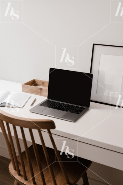 Workspace stock image of laptop mockup on desk with frame in background for women entrepreneurs