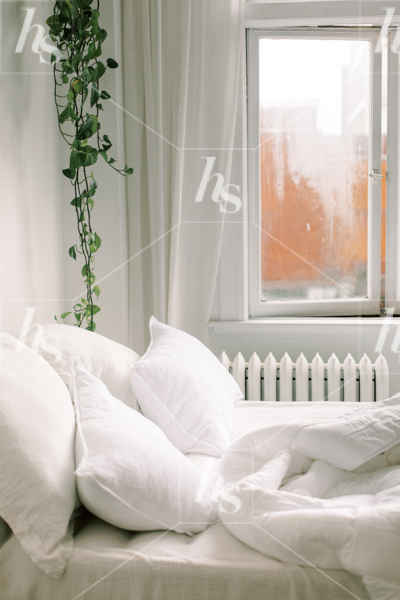 Cozy, light and airy apartment bedroom stock image perfect for interior designers and realtors