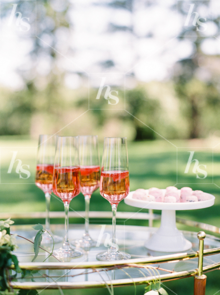 Celebration and event stock photo featuring red champagne glasses in outdoor setting