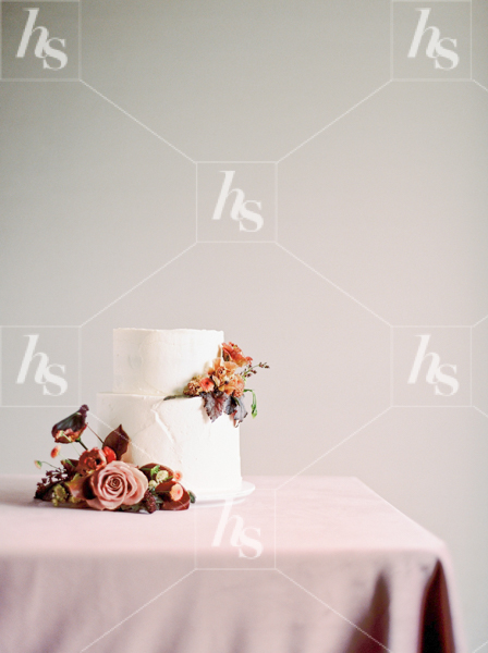 Minimal stock photo featuring a cake decorated with flowers.