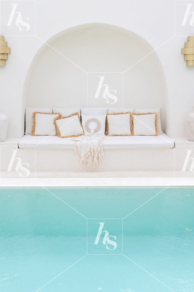 Luxurious seating by a pool, this stock image is perfect for realtors and travel bloggers