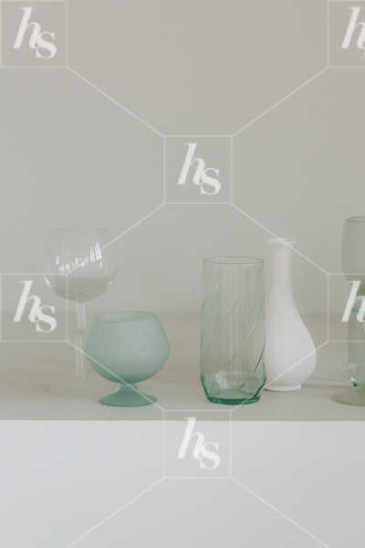 Mint styled stock photo of vases and votives on shelf
