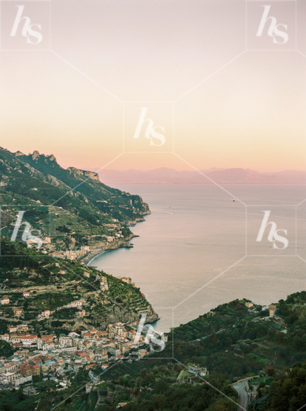 Beautiful view of a small town nestled between mountains overlooking the sea, a dreamy stock image.