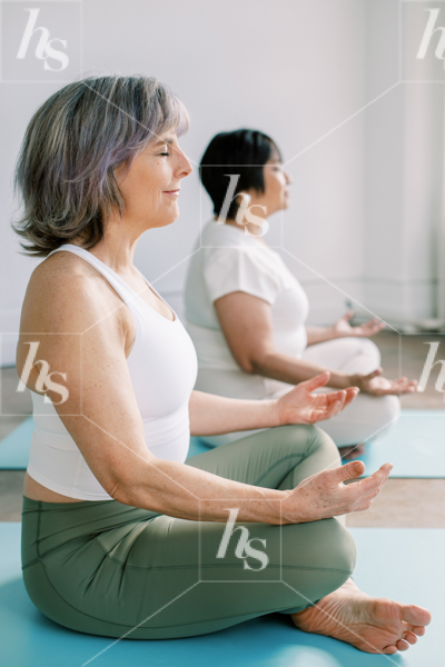 Stock image featuring women meditating