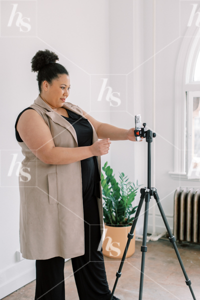 Shooting content using a tripod and phone in this collection of Stock Photos & Videos for Business Coaches
