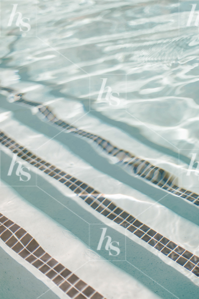 Minimal stock image of water in swimming pool.