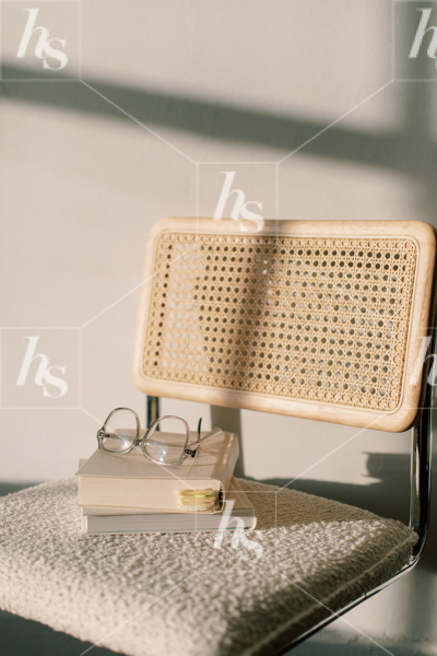 Stock photo of books stacked on vintage chair, perfect stock photo for artists and designers.