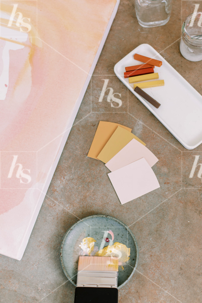 Paint swatches and canvas on floor, premium stock photo for creatives