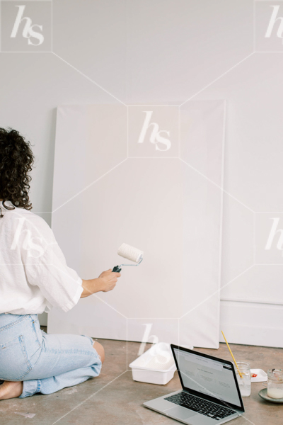 A woman painting a canvas. Premium stock photos perfect for creative entrepreneurs. Preview the entire collection at Haute Stock.