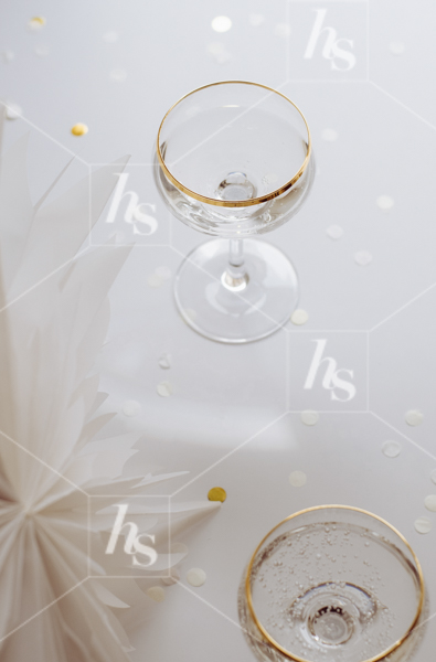Glass of champagne for holiday celebration, part of White and Gold New Year’s Eve Stock Photos.