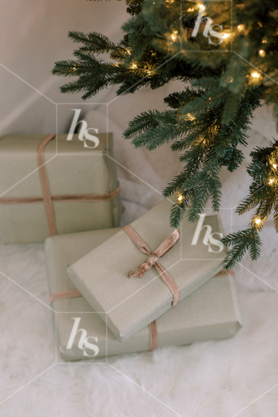Wrapped presents under the Christmas tree, part of the holiday stock photos and videos collection by Haute Stock