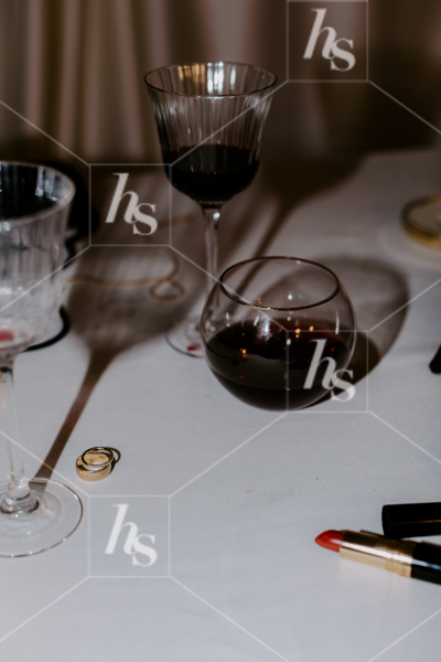 This moody NYE stock imagery collection features wine glasses, lipstick and jewelry 