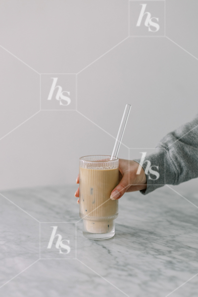 Woman grabbing her iced coffee, part of cool workspace stock photos and videos collection perfect for chill and creative entrepreneurs