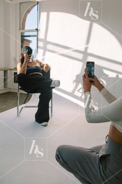 Women recording each other, part of Through the Lens workspace stock photos & videos  for content creators