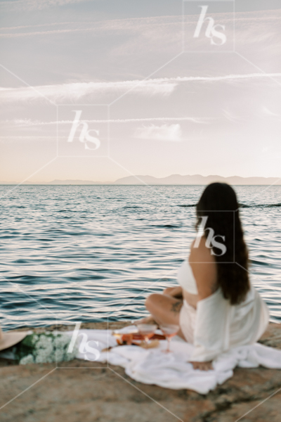 Woman relaxing at seaside, part of Sips at Sunset a fun stock photos & videos collection by Haute Stock