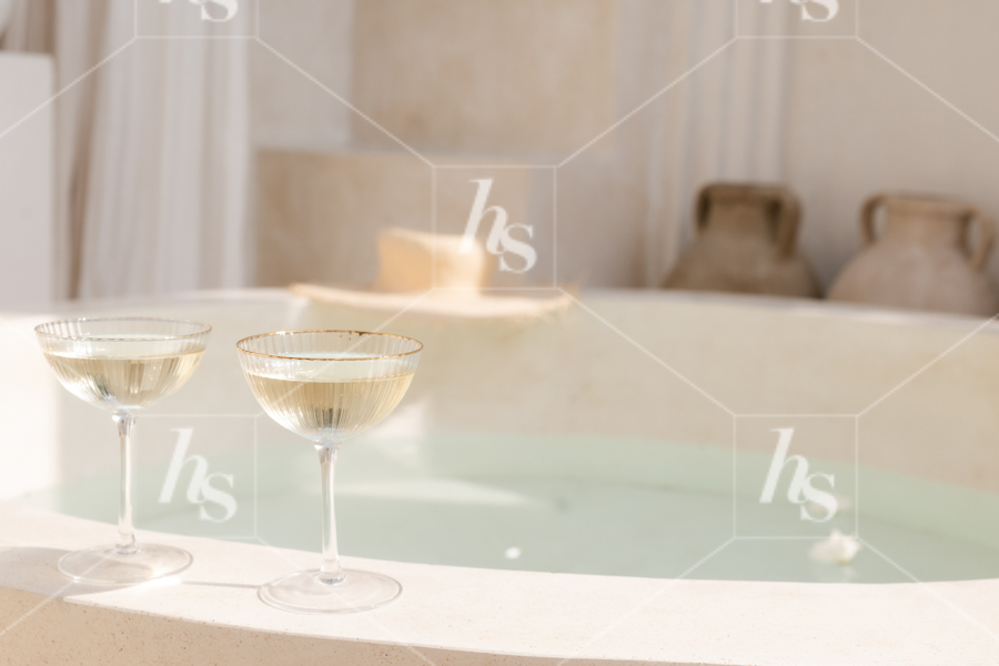 Two glasses of champagne on the pool's edge in this airy travel stock videos & photos collection by Haute Stock