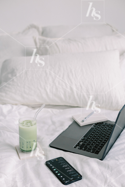 Matcha, phone, laptop, and notepad in bed, part of Matcha Time: green workspace stock photos & videos collection
