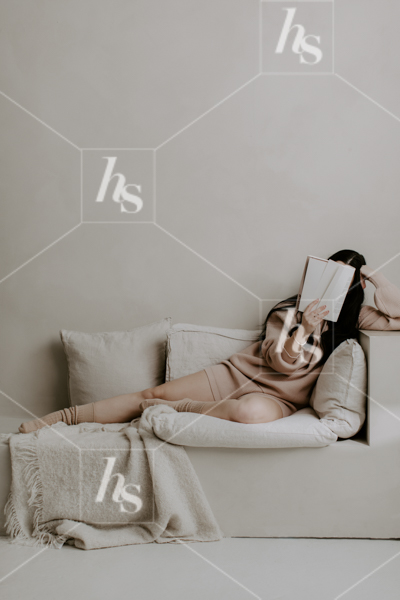 Woman in pink lounge set reading a magazine, part of Lounge, the cozy Retreat, lifestyle stock photos & videos collection