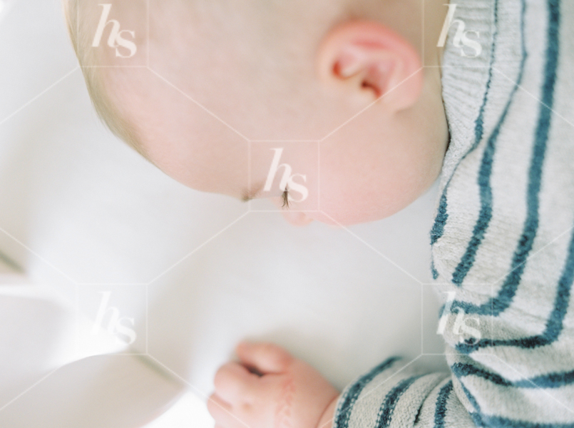 Close-up image of Baby sleeping in crib, part of Nursery baby stock photos collection