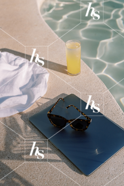 An iPad, a lemonade and a towel by the pool, part of Digital Nomad seasonal travel & lifestyle stock photos and videos collection by Haute stock