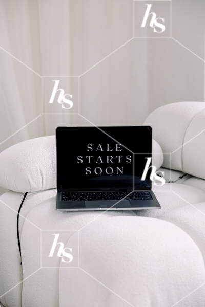 Laptop on couch that says 'Sale Starts Soon', part of Black Friday Stock videos collection by Haute Stock