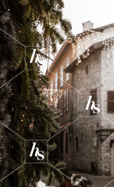 A charming European town decked out for the holidays, part of Gingerbread cozy holiday stock images collection by Haute Stock