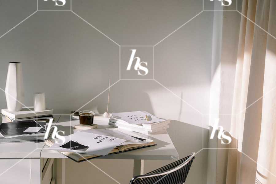 Horizontal shot of an entrepreneur's messy desk, part of Haute Stock's manifesting stock images collection