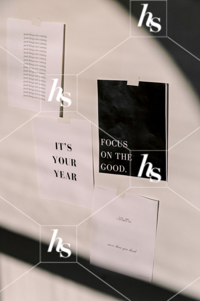 Inspirational quotes printed on paper and posted to the wall,  part of Haute Stock's manifesting stock images collection