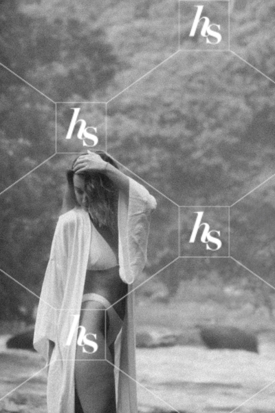 Black & white image of a woman staying next to water, perfect for empowering and beauty content for self-care and travel.