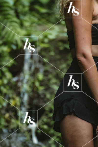 Woman is standing next to water fall, part of Mist: a collection of inspiring self-care and travel aesthetic imagery.