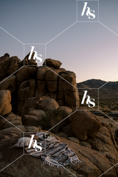 Enjoying a sunset picnic in the desert, a stock image part of Drift collection - desert and interior stock imagery by Haute Stock