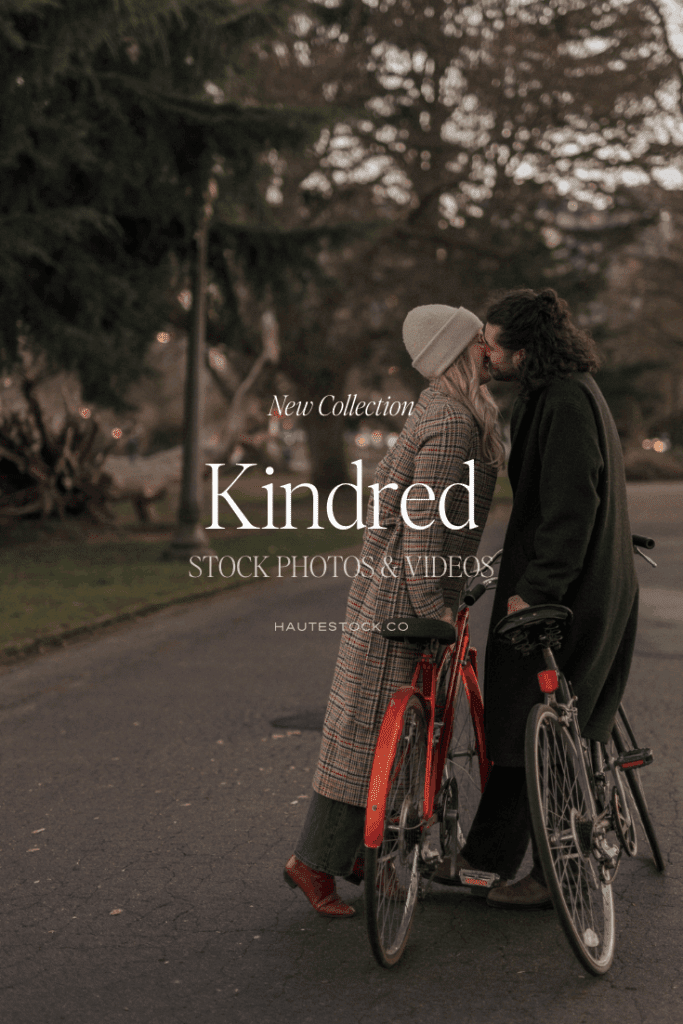 Couple kissing in Park in fall outfits next to bikes  — romantic fall stock photo from the Kindred Collection by Haute Stock.